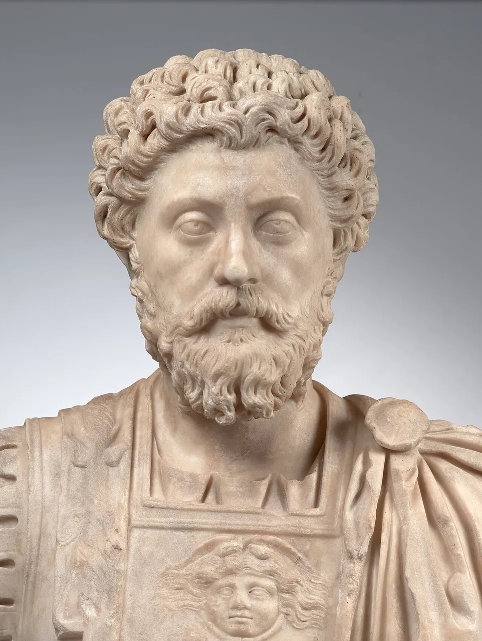 Marble bust of Marcus Aurelius with a full curly beard