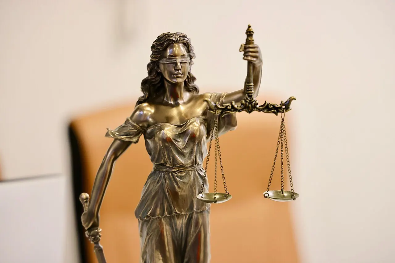 Bronze statue of Lady Justice holding scales