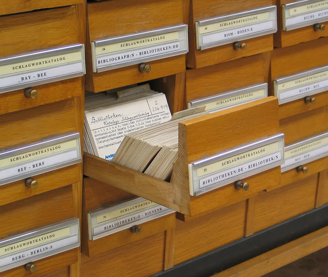 An open drawer in a wooden library card catalogue