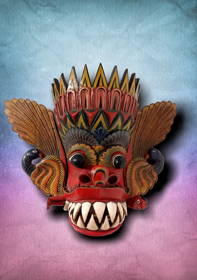 A carved and painted traditional Sri Lankan mask