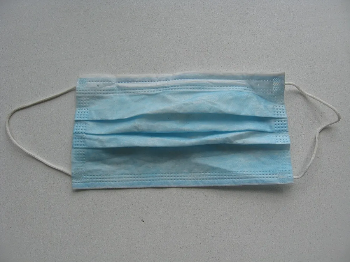 A blue disposable surgical mask