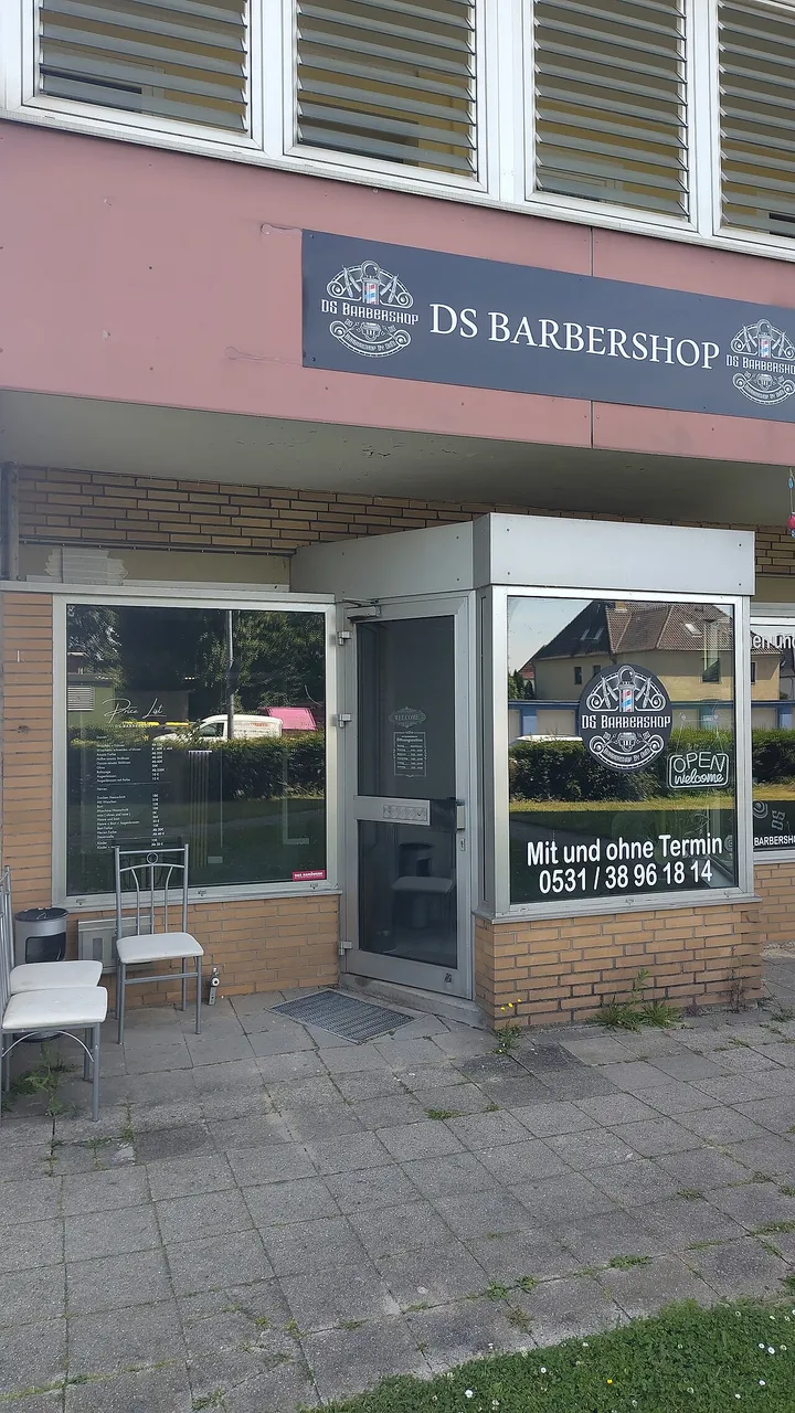 Front of a barbershop on a quiet street