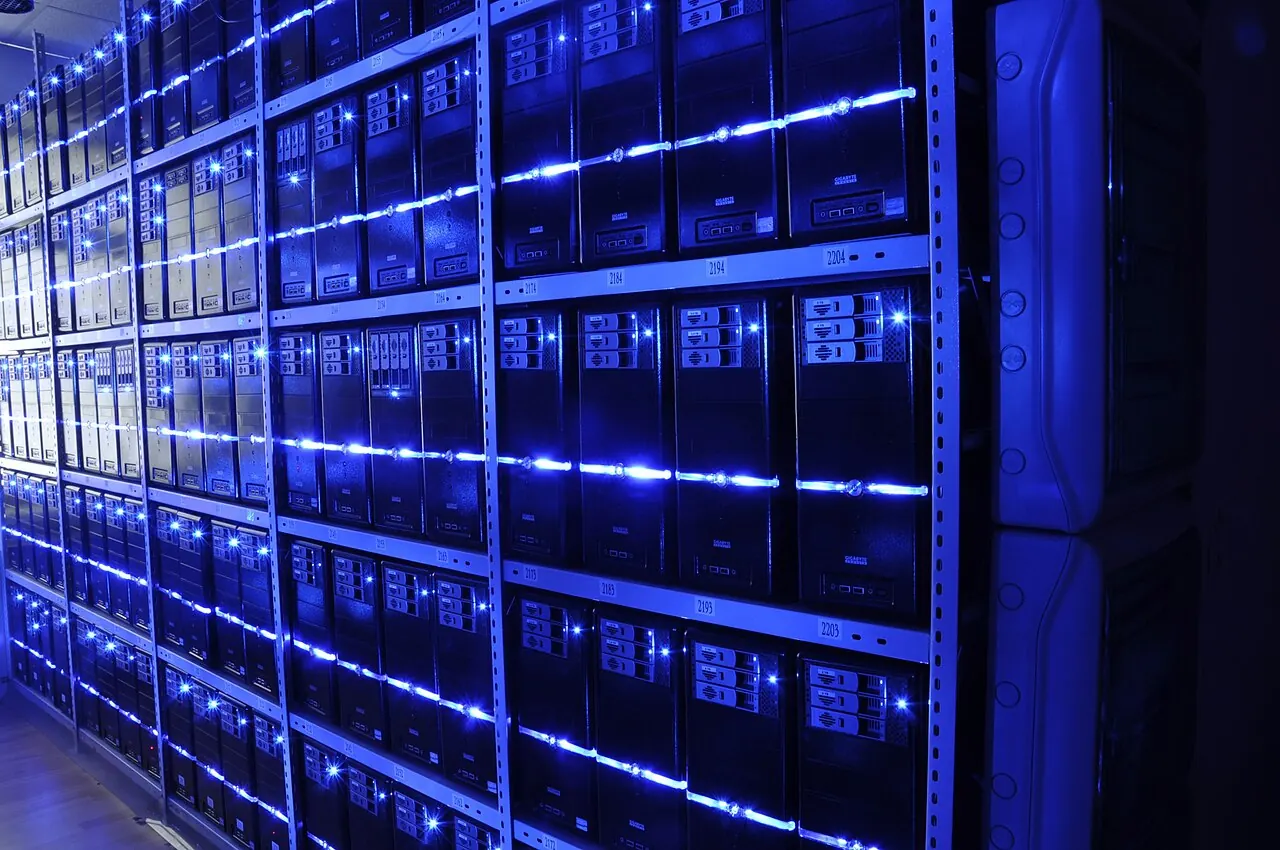 Rows of servers lit blue in a data centre