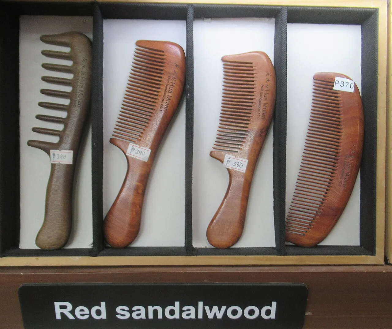 Wooden hair combs displayed in a shop