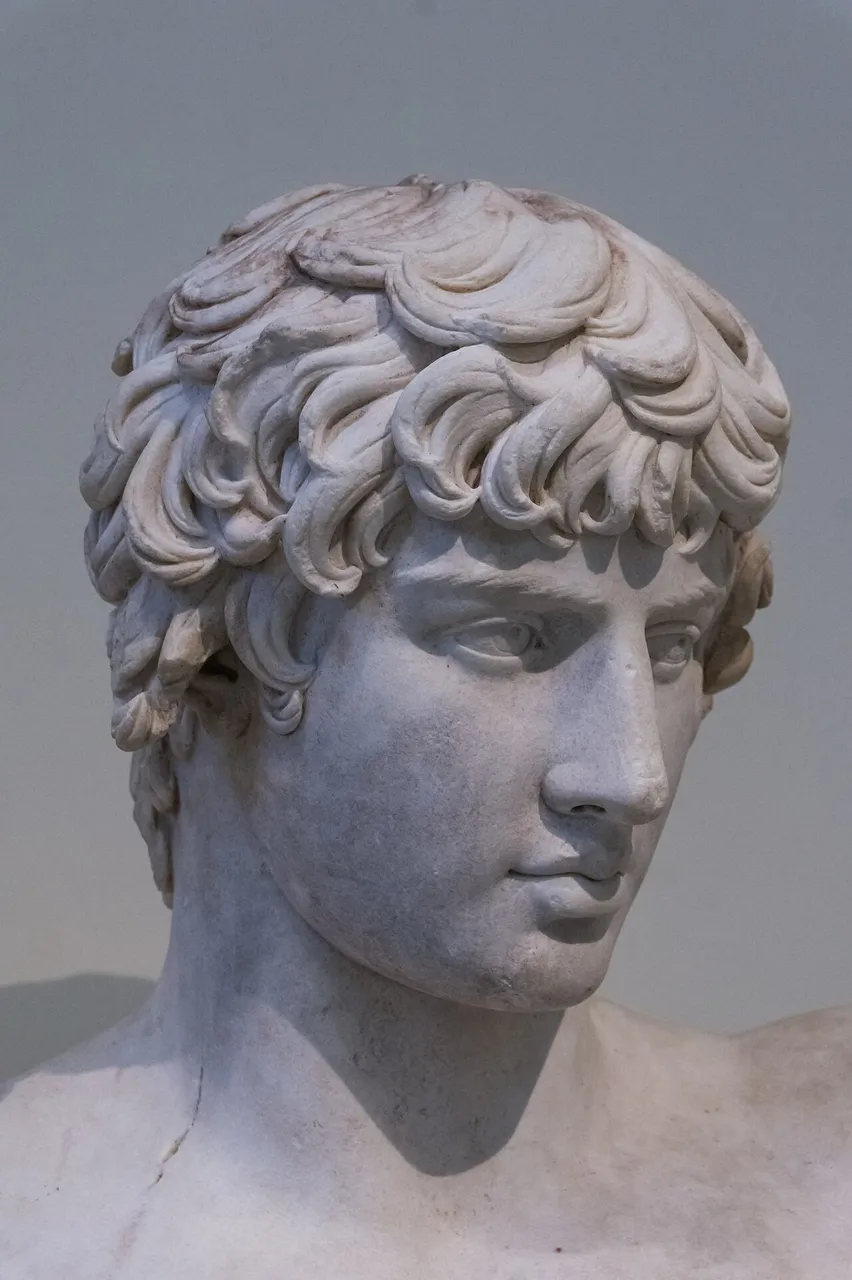 Marble bust of Antinous with short wavy hair