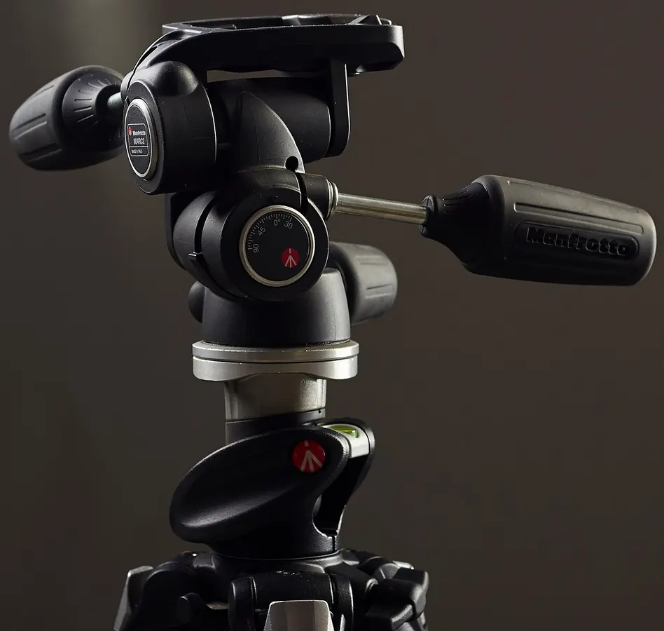 A camera tripod head with adjustment handles