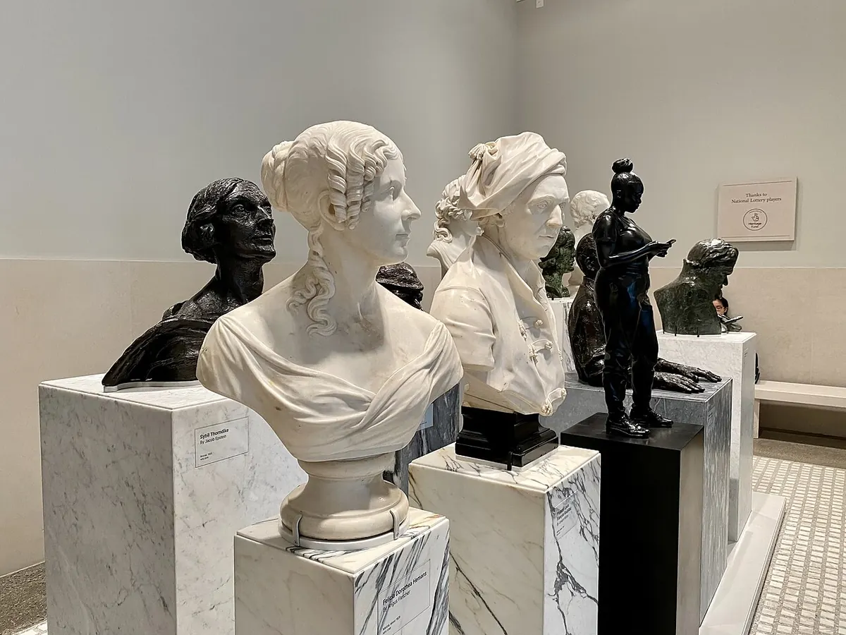 Marble and bronze portrait busts in a museum gallery