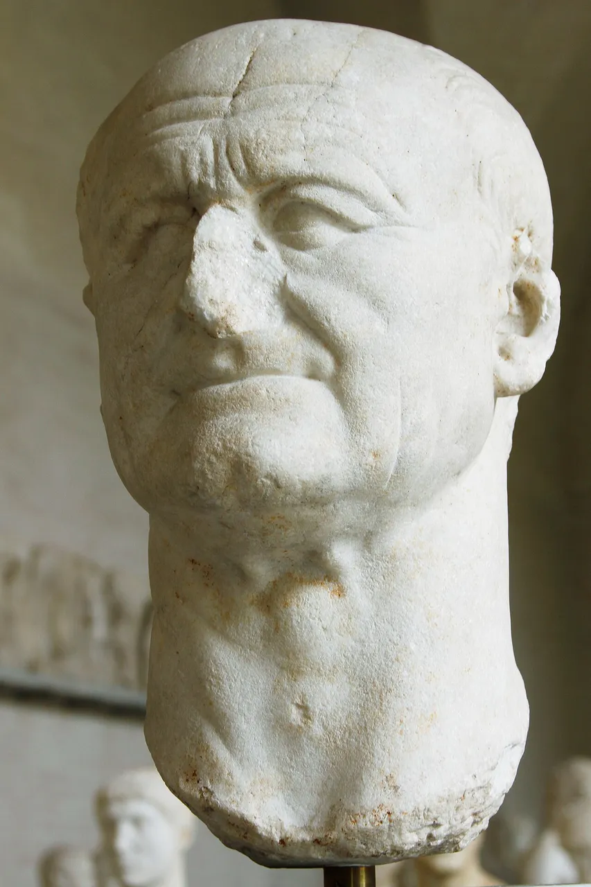 Marble portrait head of the Roman emperor Vespasian with a broad, square jaw