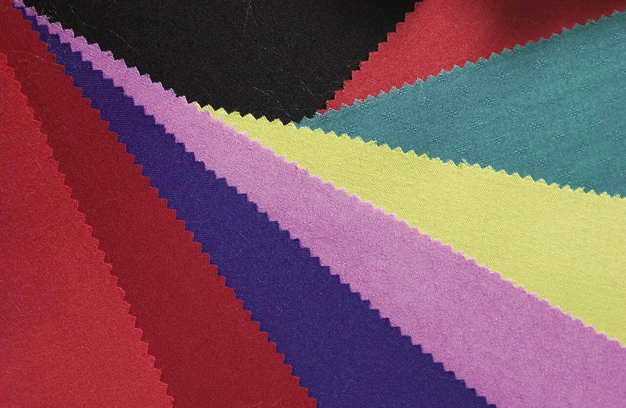 Fabric swatches in red, purple, green, yellow and teal